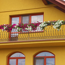 A wrought iron exterior railing - balcony railing A wrought iron exterior railing - balcony railing