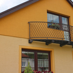 A wrought iron railing - balcony railing A wrought iron railing - balcony railing