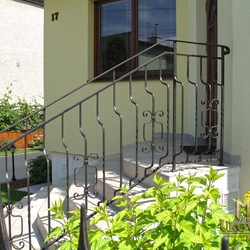 A wrought iron railing - house entrance A wrought iron railing - house entrance