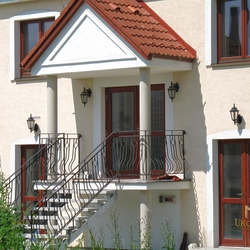 A wrought iron railing - garden stairs A wrought iron railing - garden stairs