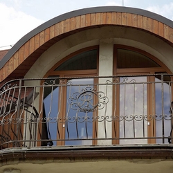 A wrought iron railing with a logo A wrought iron railing with a logo