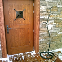 A wrought iron door grille and a hanger A wrought iron door grille and a hanger