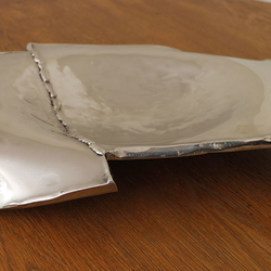 A wrought stainless steel fruit bowl A wrought stainless steel fruit bowl