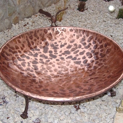 A copper wrought iron water fountain for birds A copper wrought iron water fountain for birds