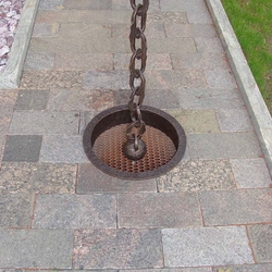 A wrought iron chain gutter A wrought iron chain gutter