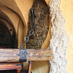 A wrought iron beam holder A wrought iron beam holder