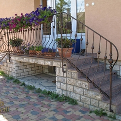 A wrought iron railing - log A wrought iron railing - log