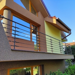 Artistic forged railings with knots forged for the balcony and terrace of a family house Artistic forged railings with knots forged for the balcony and terrace of a family house