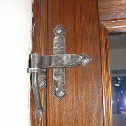 A wrought iron door hing A wrought iron door hing