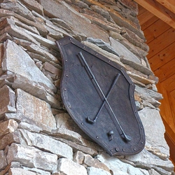 A wrought iron coat of arms - a golf motif A wrought iron coat of arms - a golf motif