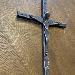 Forged wall cross as a symbol of Christianity Forged wall cross as a symbol of Christianity