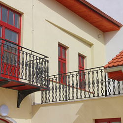 Exterior railing on the balcony - cast iron railing in a historic building - bourgeois house in Spišské Podhradie Exterior railing on the balcony - cast iron railing in a historic building - bourgeois house in Spišské Podhradie