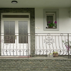 A wrought iron railing - house entrance A wrought iron railing - house entrance