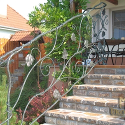 A wrought iron railing - sunflower A wrought iron railing - sunflower