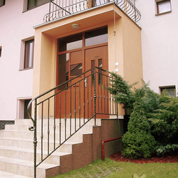 A wrought iron railing - house entrance A wrought iron railing - house entrance